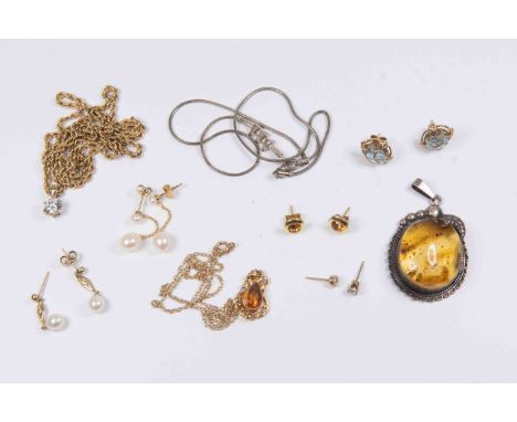 A 9ct gold citrine set pendant and earrings, a 9k gold rope twist necklace with white claw set stone pendant, 9ct gold and bl