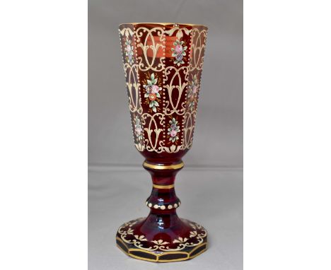 A 19th Century Bohemian chalice style vase, rim has firing chip with original over paint, deep ruby red glass with gilding an