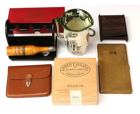 Smoking paraphernalia; a new boxed Ogdens pipe; a hedgehog pipe reamer; Paula cigarette lighter (cased) other lighter; bottle