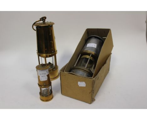 Brass mining lamp with small decorative with a modern boxed latch lamp