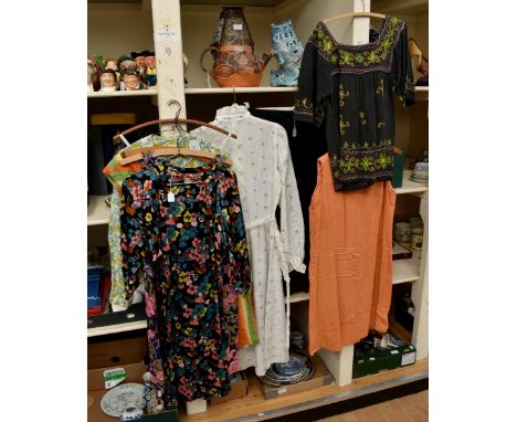 A collection of floral dresses from the 1970's to include; a flower power colourful ¾ sleeve and a large button fastening; a 