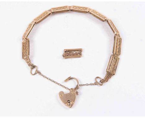 A 9ct rose gold gate bracelet with padlock clasp, spare link, approx 16 grams