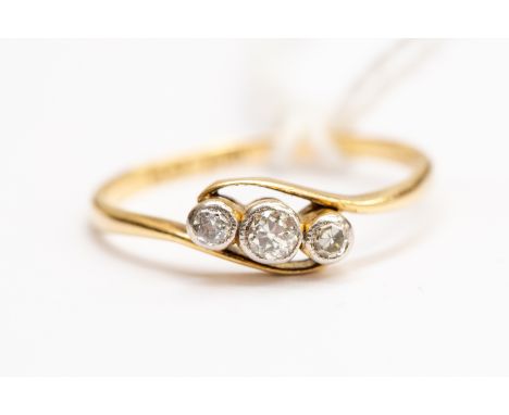 An Edwardian three stone diamond set ring, 18ct gold, size P1/2, total gross weight approx 2gms