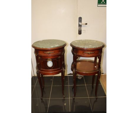 Two French style mahogany marble topped oval bedside tables, raised on cabriole legs with brass embellishments, one table hav