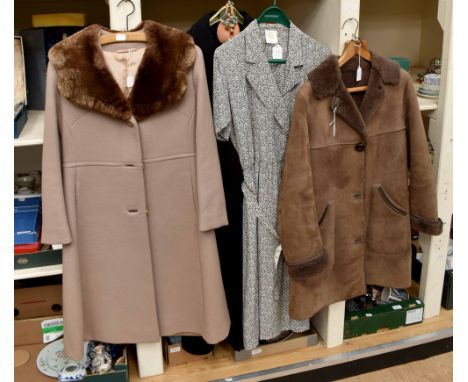 A late 1960's wool coat by "Slimfit" with a faux fur collar, fawn in collar with matching buttons, stitched waistline at fron