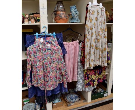 A mixed collection of; navy blouses, jacket and cami top and matching spotted navy skirt; a violet swirl with a cowl neck top