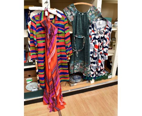 A chevron design dress in navy/red/gold/white by Kitty Copeland; a psychedelic in red/orange/pink a peasant dress; cream top,