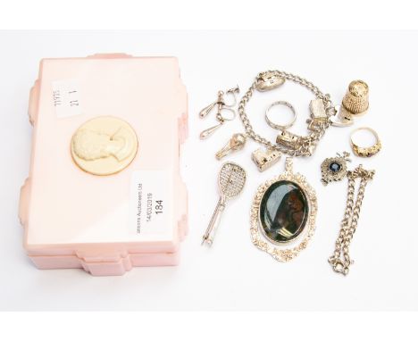 ***AUCTIONEER TO ANNOUNCE THIMBLE IS 9CT GOLD NOT 14CT ***A pink plastic jewellery box, containing two silver charm bracelets