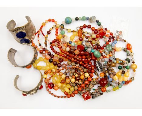 Various semi precious beads including agate, Jasper, carnelian, gold stone, etc - ten strands in total, along with a pair of 