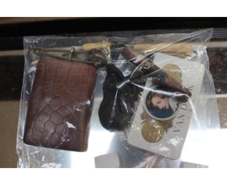 A ladies skirt lifter button hooks, needlework case and tin of needles, rolled gold button hook, etc and an 18th Century shou