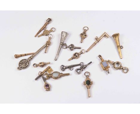 A collection of twenty novelty watch keys gold and unmarked Georgian versions, along with Victorian versions, some stone set,