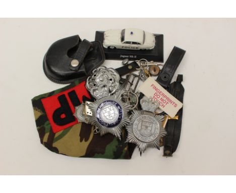 A collection of British Police Helmet Plates (Derbyshire Constabulary), Police cap badges, Police buttons, DPM camo MP Brassa