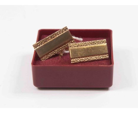 A pair of 9ct gold cufflinks, rectangular shape, polished centre  with textured borders,  swivel fixings,  total weight appro
