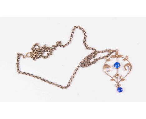 An Edwardian 9ct gold open work pendant set with blue paste stones, length approx 48mm,  on a 9ct rose gold chain, length app