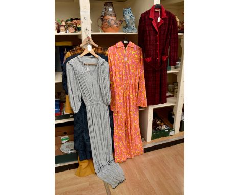 A psychedelic suit from the 1970's in burnt orange and yellow with a rolled collar and metal zip; a 1970 shirt dress in deep 