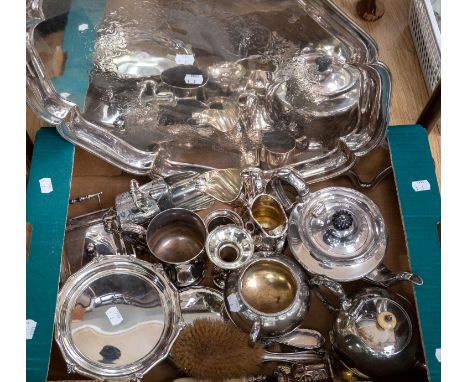 A box of silver plated items to include teapots jugs etc, and a large tray, along with an ornate presentation trowel dated 18