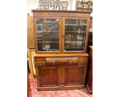 A mahogany sideboard with glazed, two door inlaid display cabinet, the base comprising of large bow fronted drawer and two si