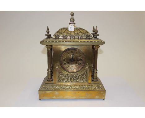 A 19th Century brass cased eight day mantle clock, in an elaborate case