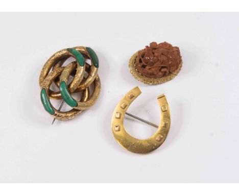 9 ct gold hallmarked horse shoe brooch, together with a Victorian pinchbeck Scottish knot brooch malachite set and a carved f