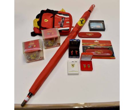 Official Ferrari memorabilia including three bags, one pencil case, two pairs of cufflinks, playing cards, two pens, one pape
