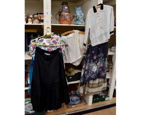 A 1950's paisley printed skirt and a black cotton late 1950's floral patterned skirt on elasticated skirt and a late 1950's n