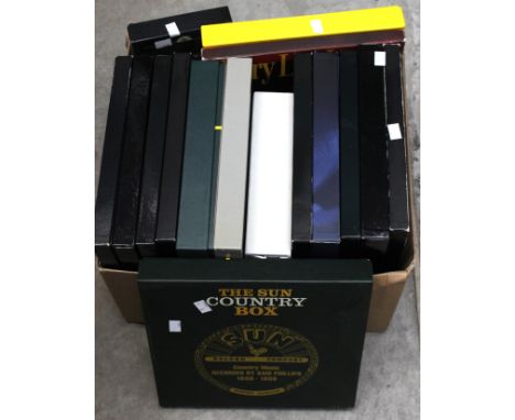 A collection of CD Album box sets, 16 in total, Jerry Lee Lewis collections, Elvis Presley, SunDew and rock and roll