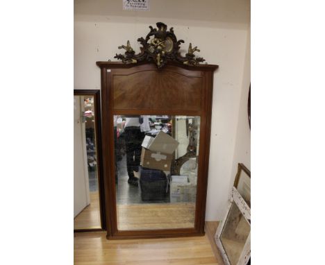 An early 20th Century veneered mirror with cherub finial, possibly French