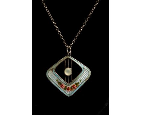A Charles Horner Edwardian enamel and silver pendant, open design set to the centre with a cabachon moonstone, light blue ena