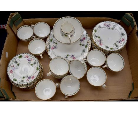 Shelley floral decorated teaset 1930/40's with gilt rim and white ground to include, eleven cups and saucers, twelve side pla