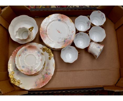 A late 19th century French teas set for six, comprising cups, saucers, side plates and a cake plate, stamped D &amp; Co Franc