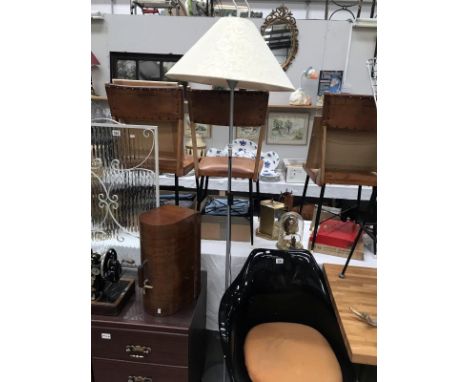 A standard lamp with shade