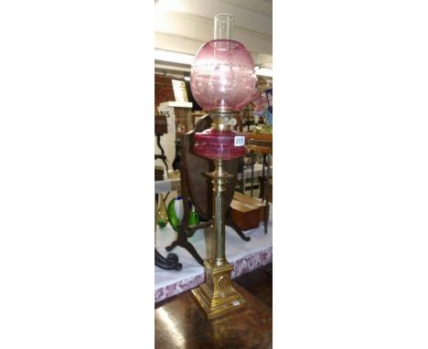 A brass column oil lamp.