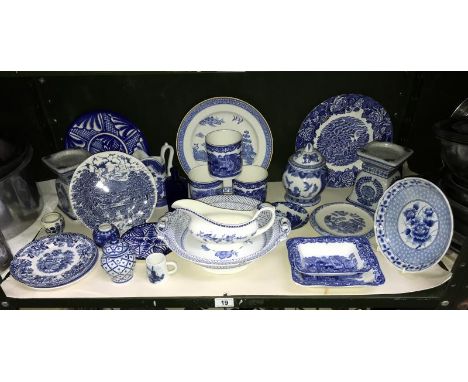 A shelf of blue and white pottery