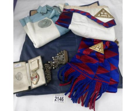 A collection of Masonic regalia including sash, apron and silver companions jewel from the Holy Royal Arch Chapter of Jerusal