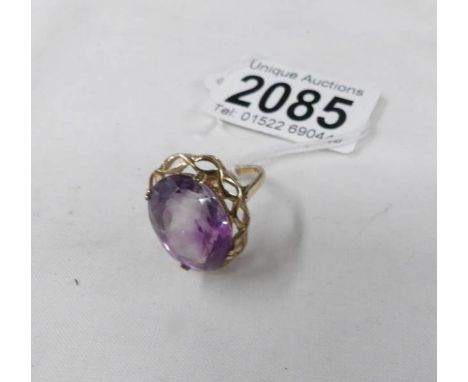 A 9ct gold ring set amethyst coloured stone, size O half.