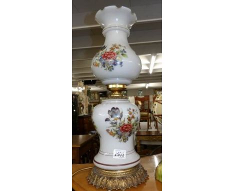 A gilt and glass floral decorated table lamp (need rewiring).