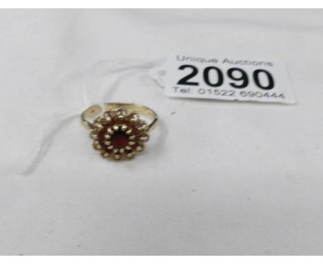 A 9ct gold ruby cluster ring, size O.