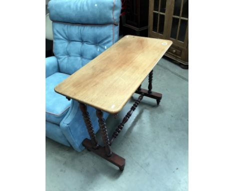 A Victorian mahogany side table with bobbin turned legs and cross stretcher