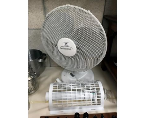A desk fan and a wall light