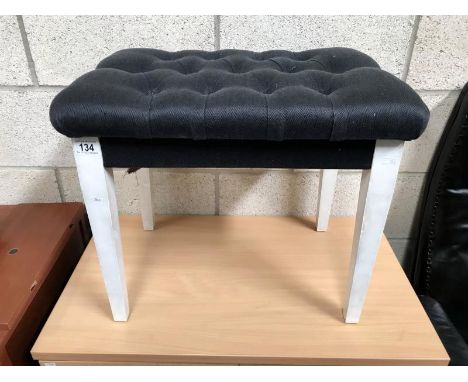 A deep button dressing table stool