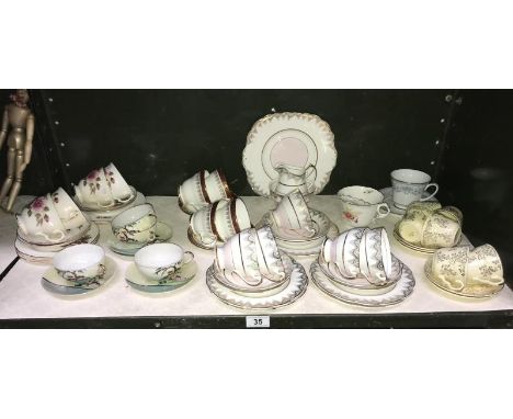 A shelf of tea sets etc.