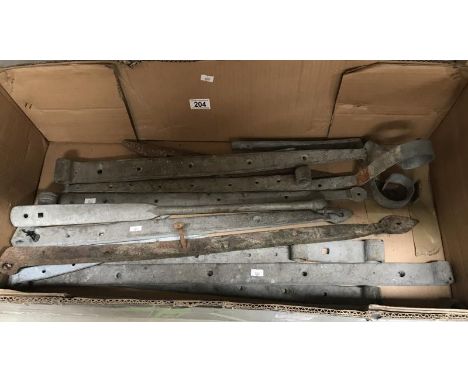 A box of large architectural hinges etc.