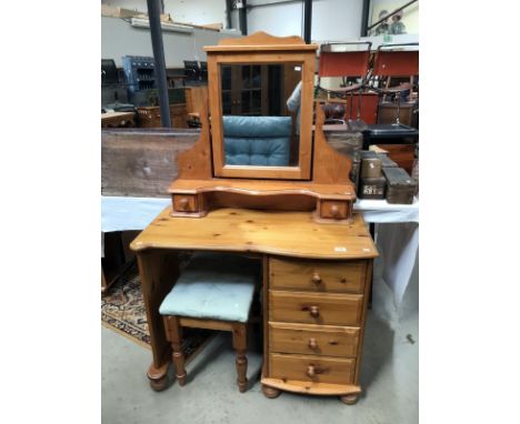 A dressing tabel with mirrow &amp; stool