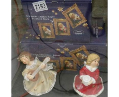 2 boxed Goebel 'Magical Christman' angel figurines.