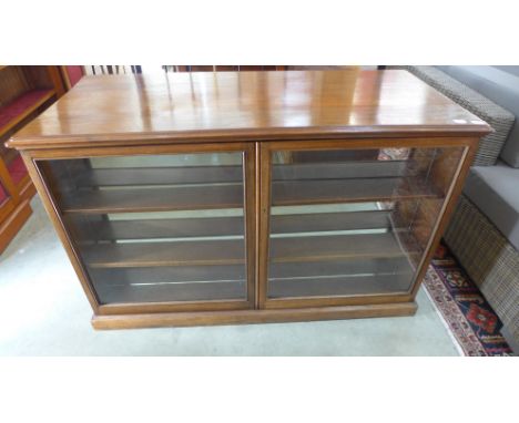 A Victorian style mahogany shop counter with shallow two door display to front and cupboards to back - Height 87cm x Width 13