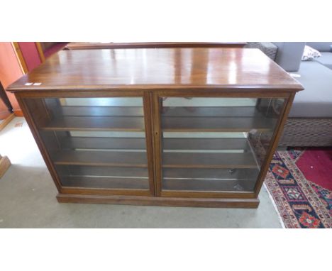 A Victorian style mahogany shop counter with shallow two door display to front and cupboards to back - Height 87cm x Width 13