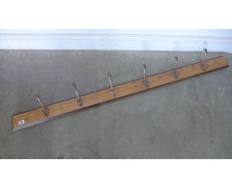 A pine and brass coat hook - Length 153cm 