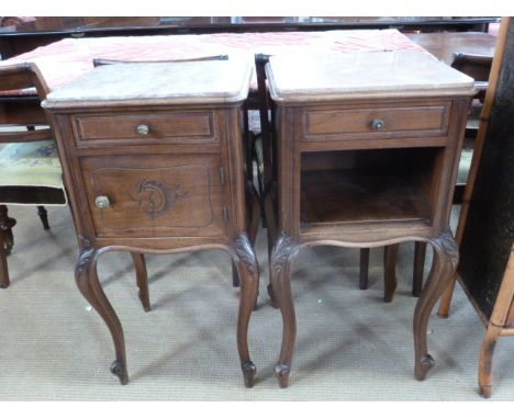 A pair of late 19th century French walnut bedside cabinets on cabriole legs, one fitted with drawer above door and marble lin