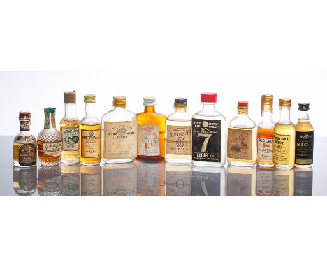 12 ASSORTED WHISKY MINIATURES
Includes American whiskies: Southern Comfort, 1/10 pint, 87.7° proof; Kentucky Tavern, one-tent