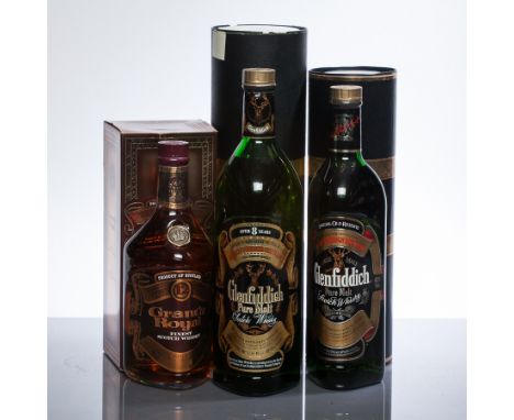 GLENFIDDICH SPECIAL OLD RESERVE
Pure Malt Scotch Whisky. 75cl, 40% volume, in tin. 
GLENFIDDICH OVER 8 YEARS
Pure Malt Scotch